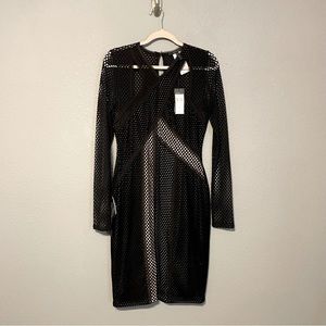 Below the knee black cocktail dress. NWT never worm. She’s gorgeous 🖤